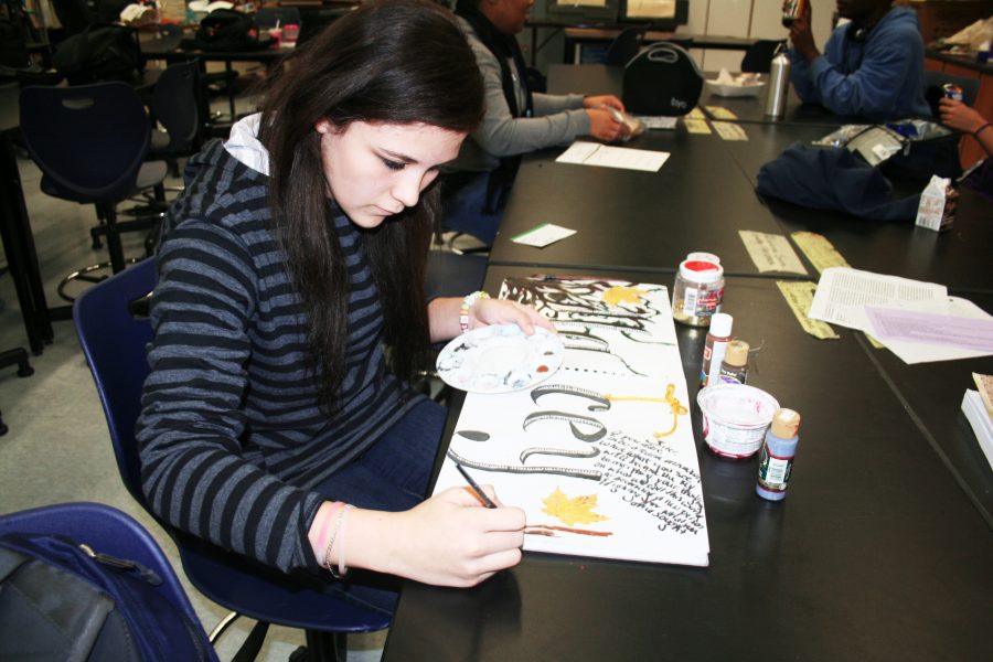 AP Art student Macey Withrow works on her art piece in preparation for the next portfolio day. Photo by Adam Kemp 