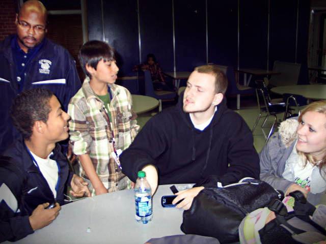 From right to left, EFE/EFA students Alex Bridges, Joey Veeder, Justin Perez, and Brandie Batten wait in the cafeteria before their next class. Although EFE/EFA students do not have anywhere to be once they return from their off site class, due to the heightened security with the tardy procedure, an officer checks in on where they need to be. Photo by Sarah Sherman