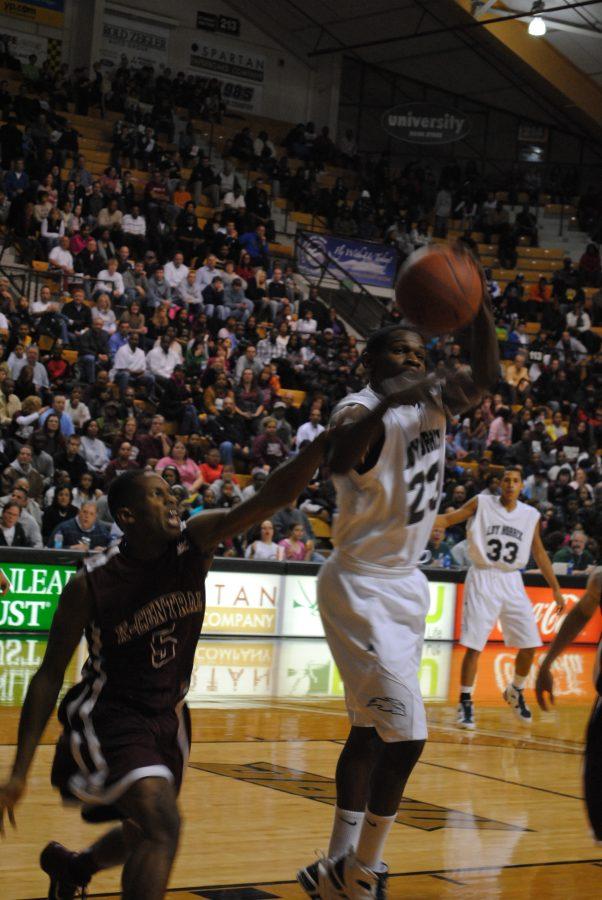 Tony Boykins shoots during a game during the 2011 Boys Basketball Season. Boykins is a forward. He and the rest of the 2012 team hopes to defeat Central this week.