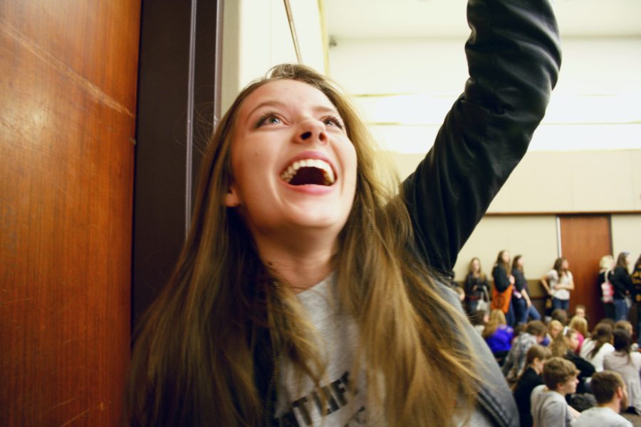 Senior Knight Life reporter, Sarah Sherman cheers as she wins first place in the category of Illustration.  Sarah brought home three state awards on April 17th, making her school and the newspaper staff proud.  Photo by Leah Rathbun