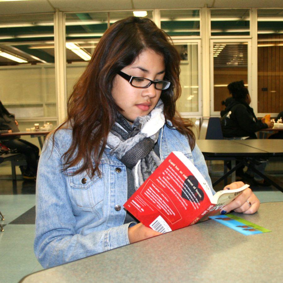 Executive leader of the GSA Cynthia Romero Diaz sits at lunch reading for English. She actively speaks out for the LGBT community in and out of school. 