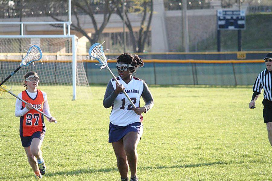 Senior Zinzey Ndluvo yells to her teammate the she is open. She sprints down the field and tries to score. 