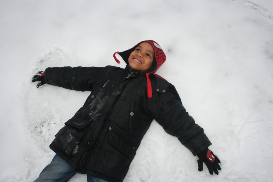 Antrell Jr. makes a snow angel in his grandmas backyard. He enjoys winter time. 