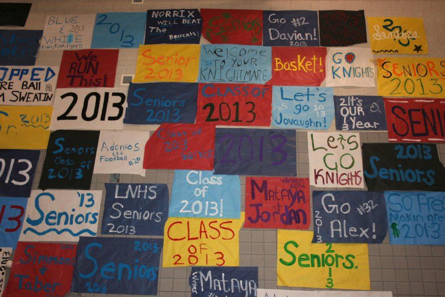 Photo Credit/ Sydnee Stannard

The class of 2013s posters fill the wall, from bottom to top. Many students stayed after school all week to paint these posters and represent their class.