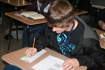 Photo by Jay McintoshJunior Brian Bartley focused full attention to his Economics final exam.  Bartley relies on his good memory skills to pass classroom tests.