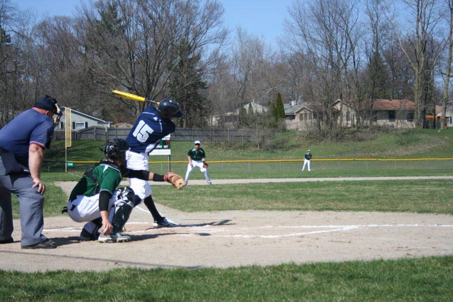 Photo by Mia Leibold
Loy Norrix Senior varsity baseball player Thomas Hruska swings the bat at the Norrix varsity game against Hackett on April 22, 2013. Norrix falls with the final score 1-8, Norrix is now 1-2 on the season.