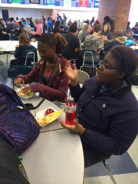 Elizabeth Gbogi sits with her friends during lunch here at Norrix, and talk about their current classes.