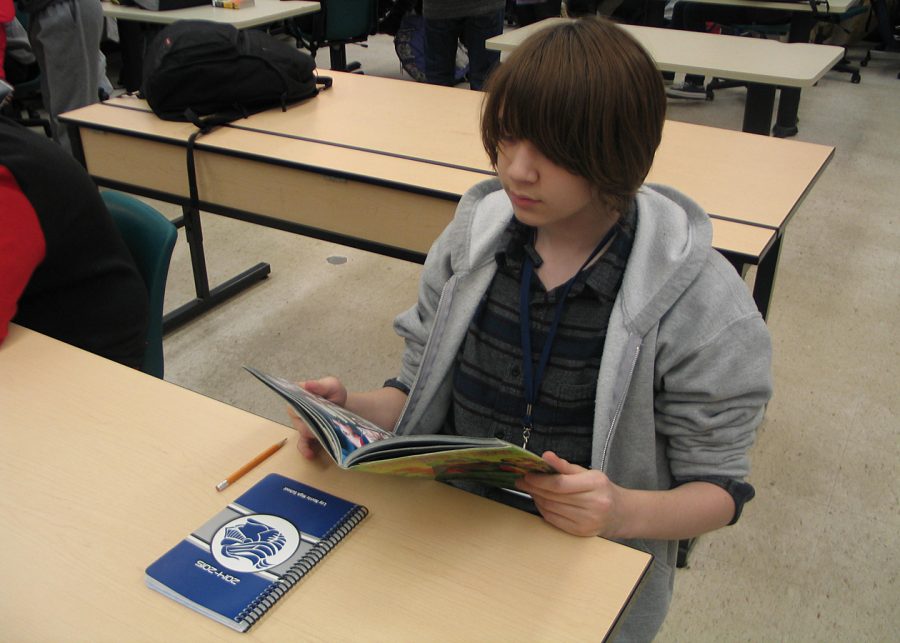 Freshman Bela Coats focused on reading the comic book Kingdom Come, written by Mark Waid and art by Alex Ross. Coats says hes been reading Kingdom Come for a couple of days. Photo Credit / Kyron Williams 