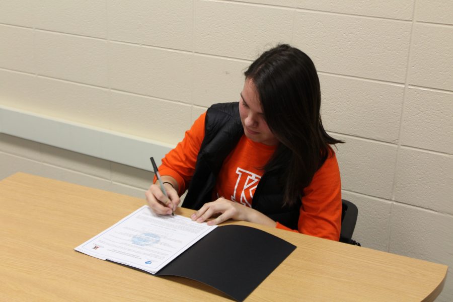 Julie Zabik signs her commitment to play with the K-College womens soccer team. Shes been a part of the Loy Norrix womens soccer varsity team since her freshman year. Photo Cred / Caitlin Commissaris