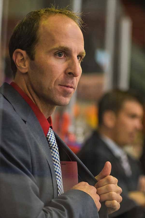 Sam Ftorek in the players box coaching the Team. This is his first season as assistant coach. Photo Credit / John Gilroy Photography