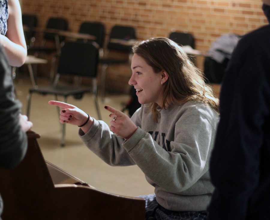 Junior Grace Erway sings and directs the voices of the team. While she does this, she adjusts their pitches and respective notes to make the finished product sound more audibly appealing. Photo Credit / Sidney Richardson
