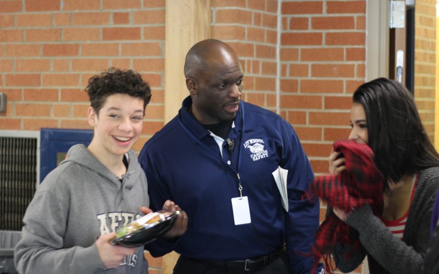 Ssebugawo can be seen joking with students. He makes it his goal to make students feel comfortable and welcome at Loy Norrix. Photo Credit / Rachel Zook