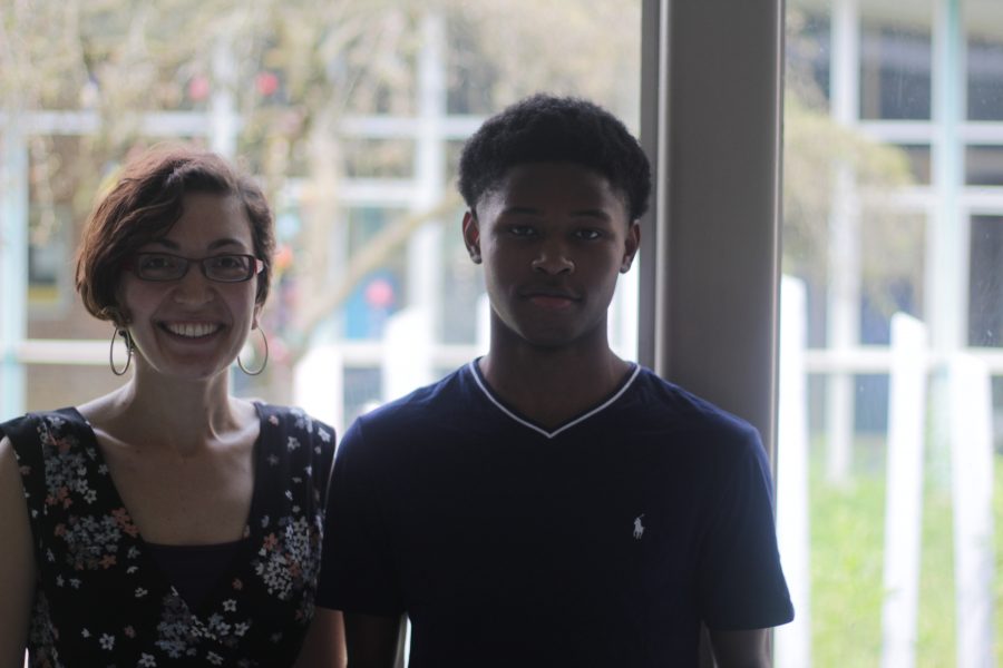 Loy Norrix Junior Ardriques McFerrin poses with teacher and inspiration for poetry, Anna Gutman. Both Gutman and McFerrin enjoy writing poetry. Photo Credit / Will Dales