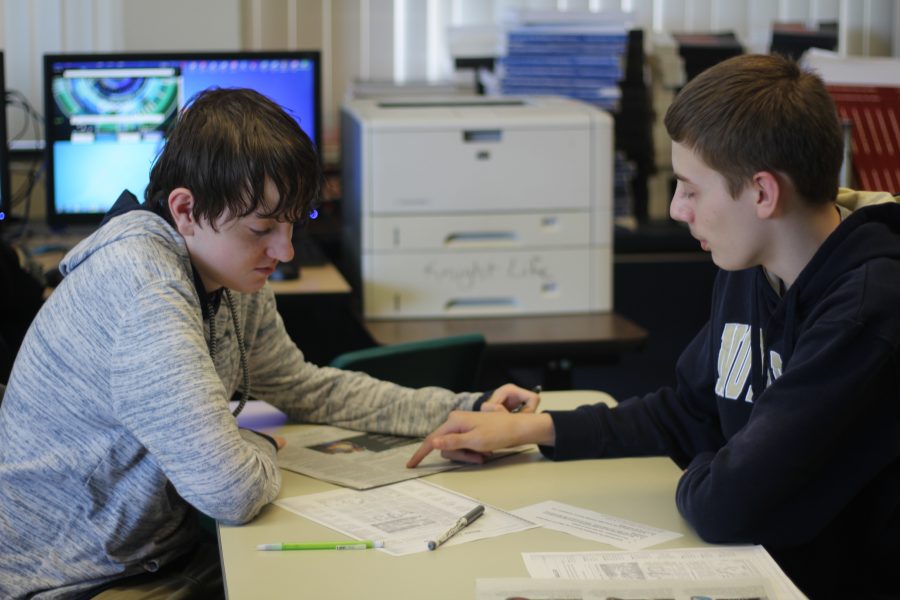 Classmates Brandon Schnurr and Hunter Sandt work on a newspaper newspaper project in Jounalism. Brandon and Hunter have known each other for about two years now and become good friends. Photo Credit / Breyana Wilson