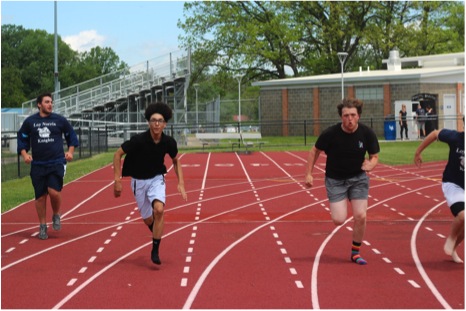 Delvin Swift (black shirt on left) races Zack Sims (on right) at the Academic Pep Assembly to pass time. Before the race, Zack bragged and bet the other racers he could beat them. Photo Credit / Josh Hentkowski
