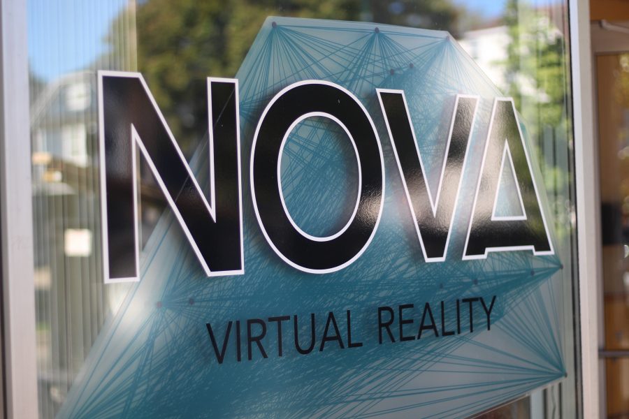 Nova Virtual Realitys logo on the window of the building. Visitors see it as they walk in.