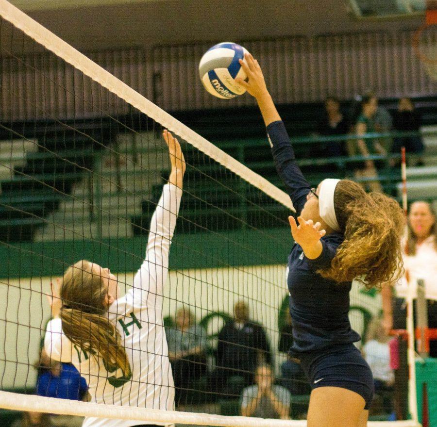 Junior Sierra Knight us pictured tipping the ball over the net earlier than anticipated. The Knights spent their season focusing on their offense, specifically at the net. Photo Credit / Paul Guimond 