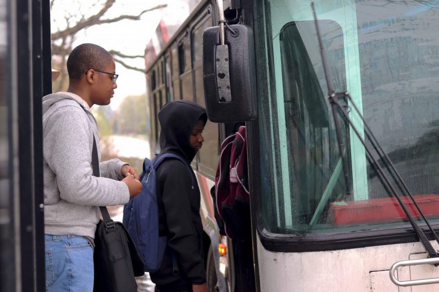 Loy Norrix students, Tayvon Davis and Jeremiah Nelson, board the bus at the 2:45 stop to head home. With the new Metro policy the students will no longer be allowed to ride for free between 2 to 4 p.m. 