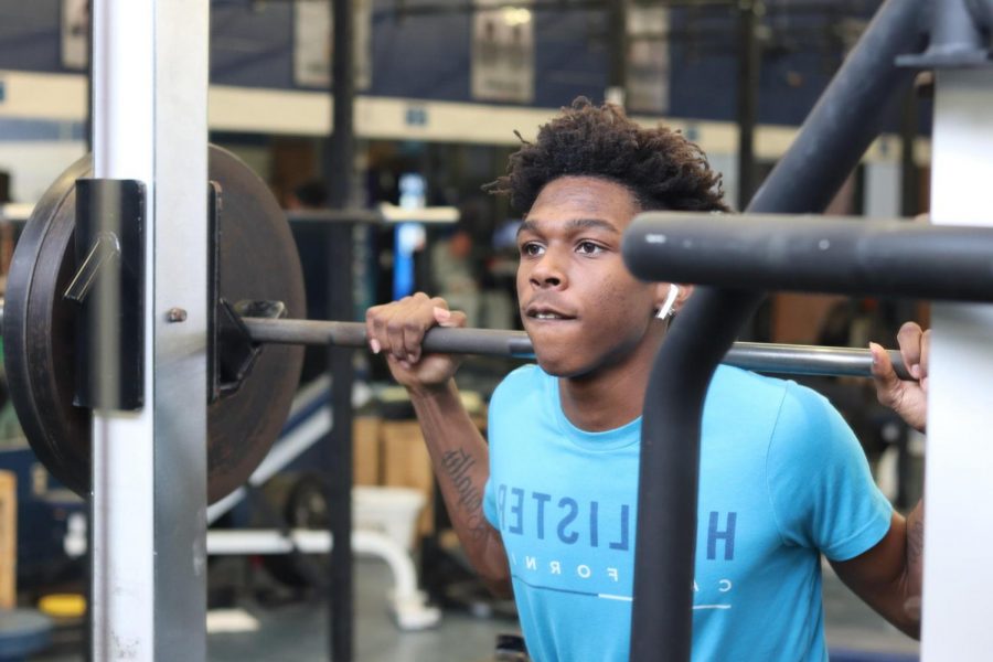 Junior JaMari Jackson works out in the Loy Norrix weight room to start the New Year off right. Jackson plans on continuing to workout throughout the year.