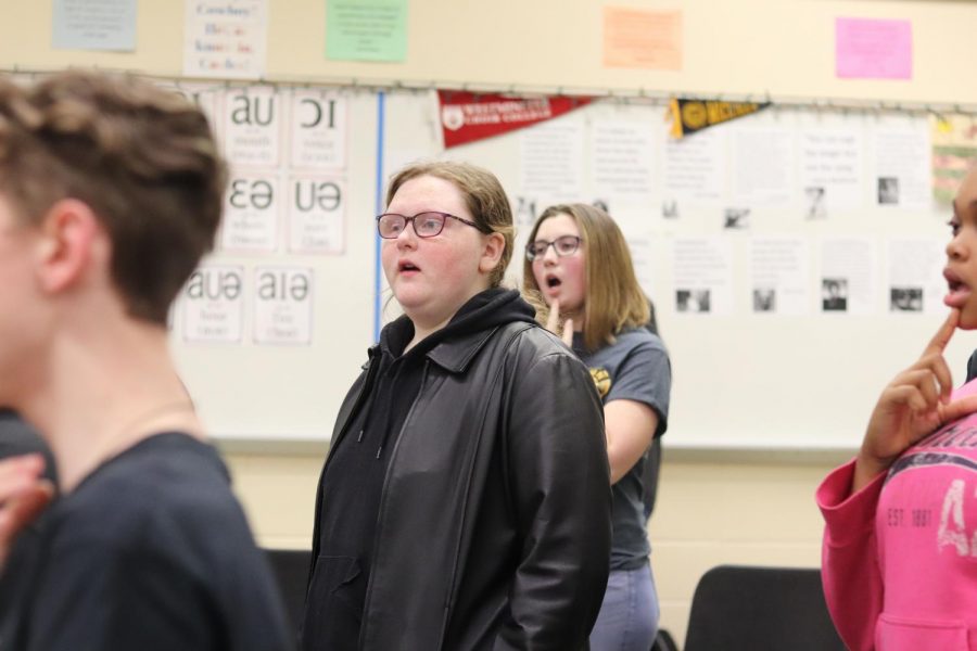 Jessica DeRyke sings in choir teacher Julie Pelligrinos class.  Despite challenges, DeRyke excels in her school work and finds joy in singing.