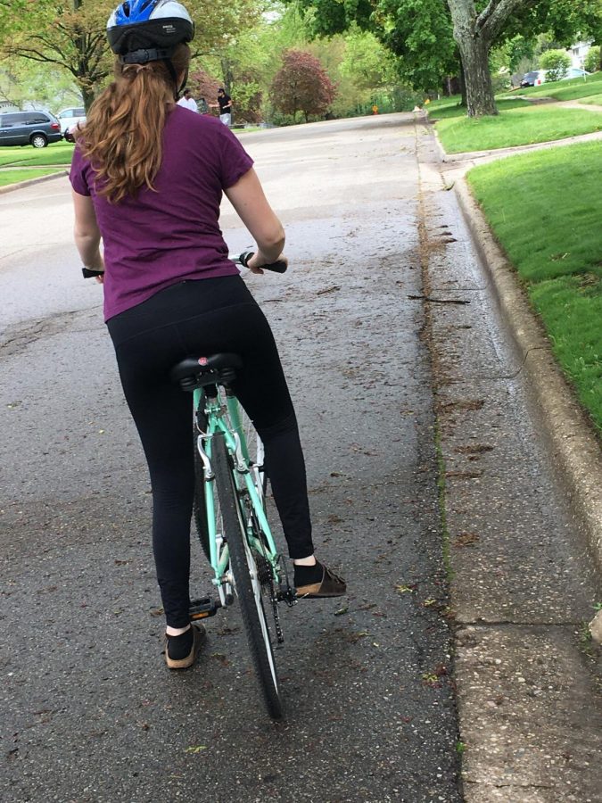 Junior Lily Stickley is showing the proper side of the road for bikers. With the traffic or the right side of the road.