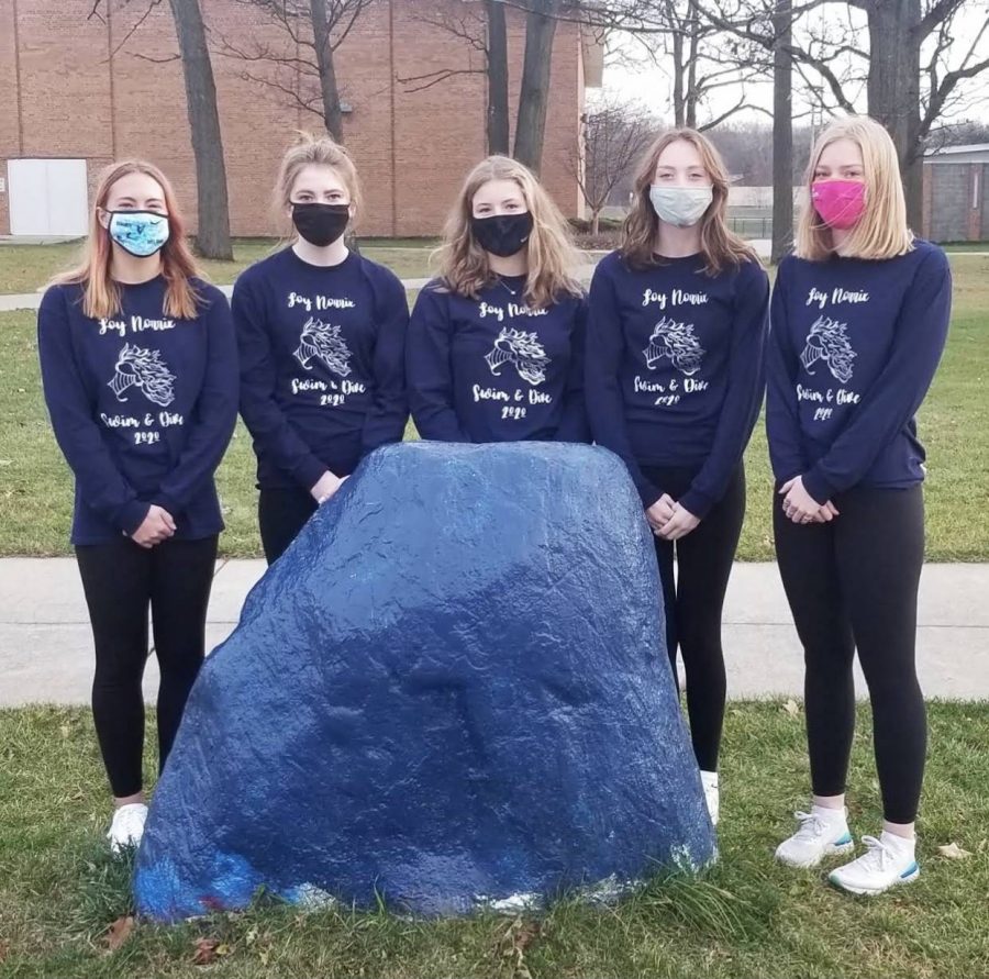 Loy Norrix Swim and Dive team gets ready to go to States. In the photo from left to right there is Samantha Vande Pol (diver), Norah DeYoung, Annika Schnell, Grace Mahar, and Ellie Haase.