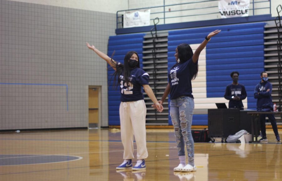 Senior Integrity nominees:  Destiny Clark and Neida Jaimes dance together after their names were called during the pep assembly. 