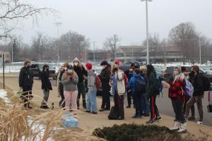 Loy Norrix students led by members of third party organizations and fellow student leaders stand outside of Loy Norrix High School. Students walked out to protest KPS COVID and policing policies.