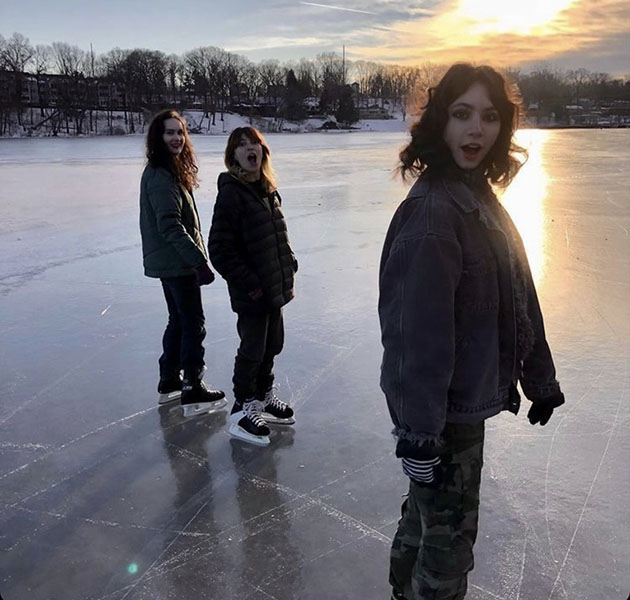 Left to right; Sophomore Josephine Velo, Senior Isabela Neves Cordeiro, and Sophomore Odessa Clemente, ice skating on Woods lake. In normal winter seasons, Michigan lakes can have ice around six inches thick.
