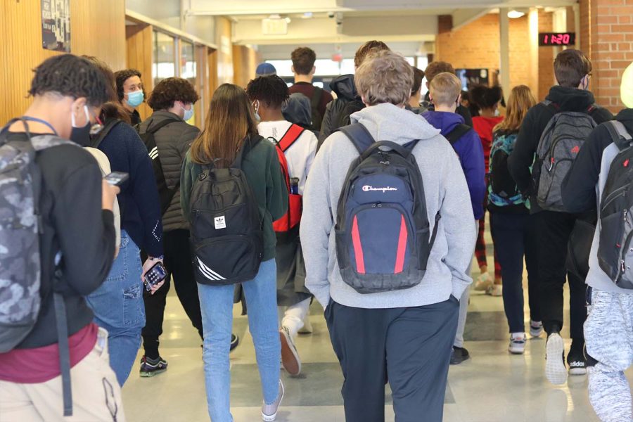Loy Norrix students walk through the main hallway during passing time between second and third period.  Part of the ALICE training is making sure that all students, no matter where in the building they are, have the information they need to make decisions for their safety
