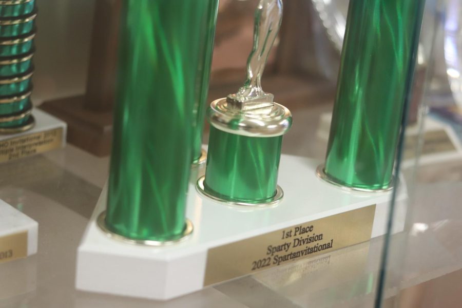 In the trophy case outside drama teacher Dan Laffertys classroom sits the first place Spartan Invitational award.  Its a tall one, with three shiny green pillars meeting at the top with a silver star.  
