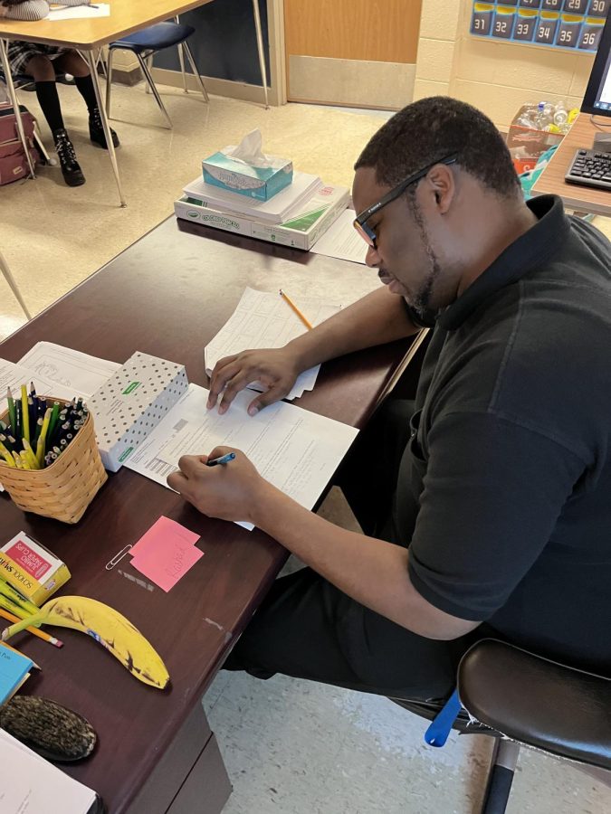 Social studies teacher Richard Rashad catches up on grading he missed. He has fallen a little behind but is working his way up to catch up to his original planned day. 