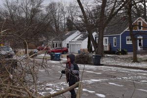 10 year old Kaelem Helms spending his morning off of school cleaning up brush, left around his house after the ice storm.