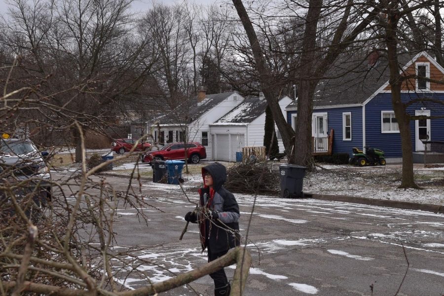 10+year+old+Kaelem+Helms+spending+his+morning+off+of+school+cleaning+up+brush%2C+left+around+his+house+after+the+ice+storm.