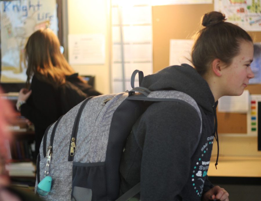 9th grader Ashlyn Teal and others waiting for the bell in Mrs. Pankops 4th hour Journalism class. She is carrying her backpack with her KAMSC supplies.