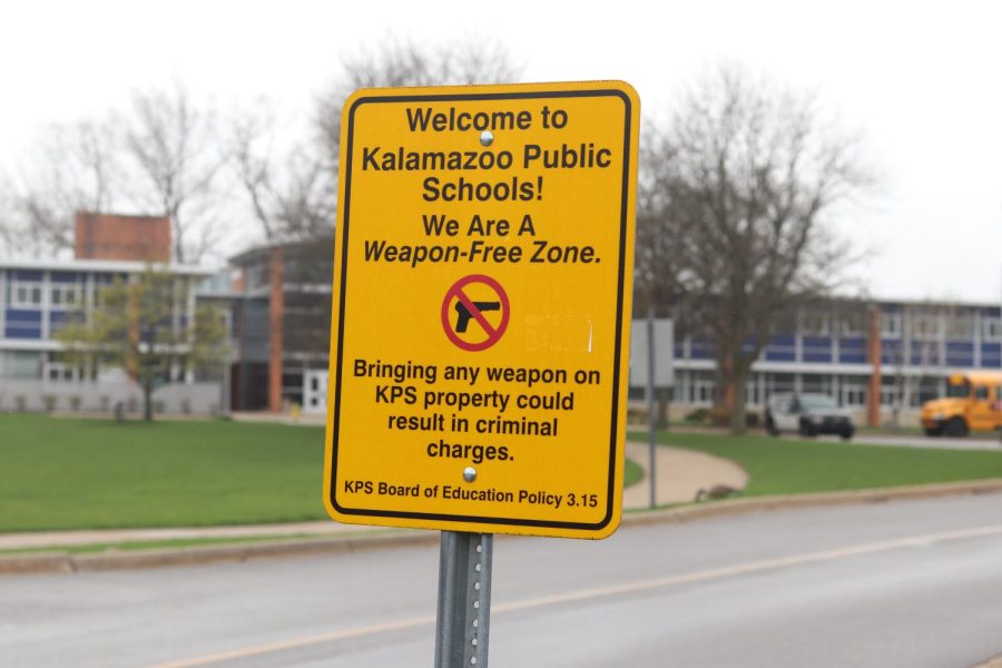 This sign posted in the Loy Norrix parking lot reminds everyone that weapons are strictly prohibited on campus.  Many KPS schools have these signs outside their buildings. 