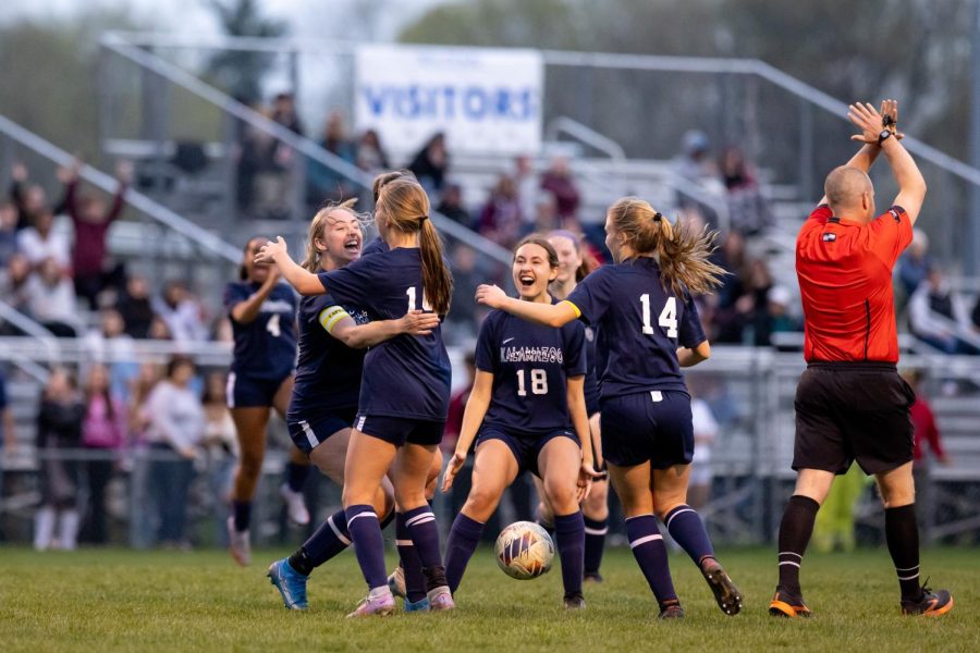 Madeline Chappa scores a goal against Kalamazoo Central, making the score 2-0. The team comes together to celebrate the lead. 