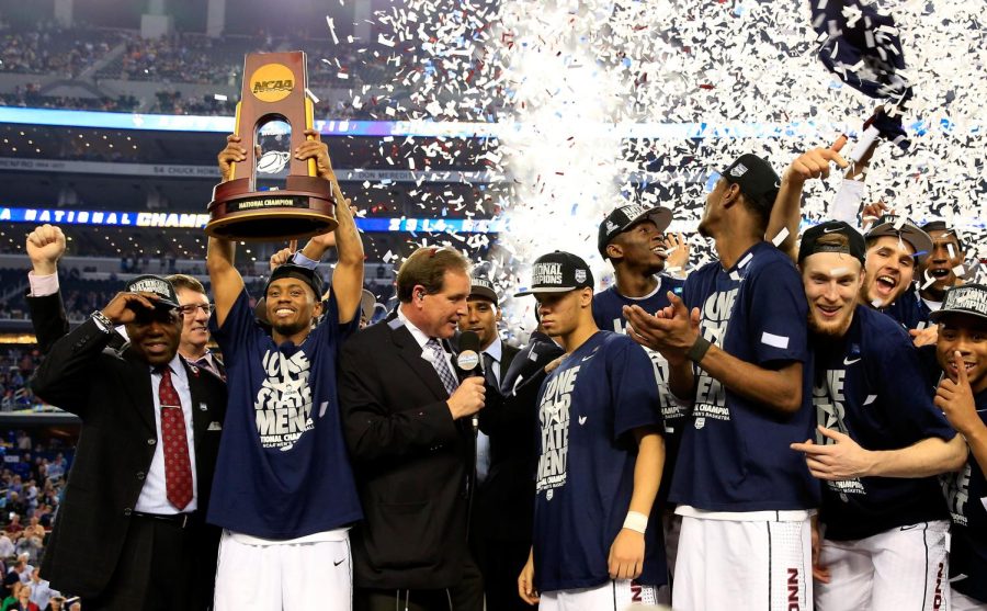 UCONN+mens+basketball+team+proudly+holding+up+the+trophy+after+shocking+the+world.+On+April+3rd+in+Houston%2C+at+the+NRG+stadium+UCONN+defeated+San+Diego+State%2C+completing+their+miracle+run+in+the+yearly+%E2%80%9CMarch+Madness%E2%80%9D+tournament.