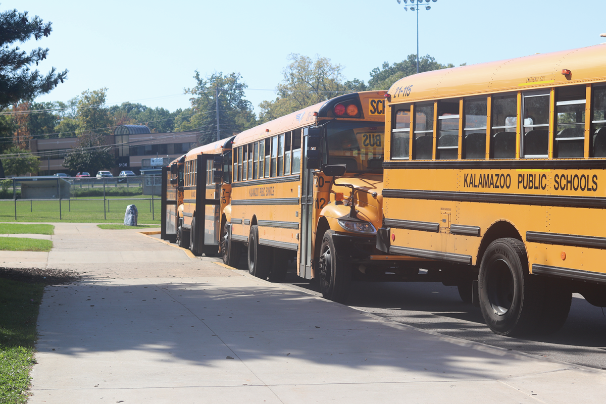 Buses line up after school at Loy Norrix to pick up students. 