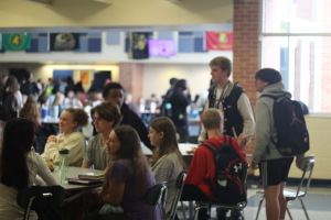 A table of freshmen eat and talk during C lunch. Unlike previous classes, the class of 2027 experienced the effects of COVID-19 in elementary school, which has had some long-lasting impacts for them.