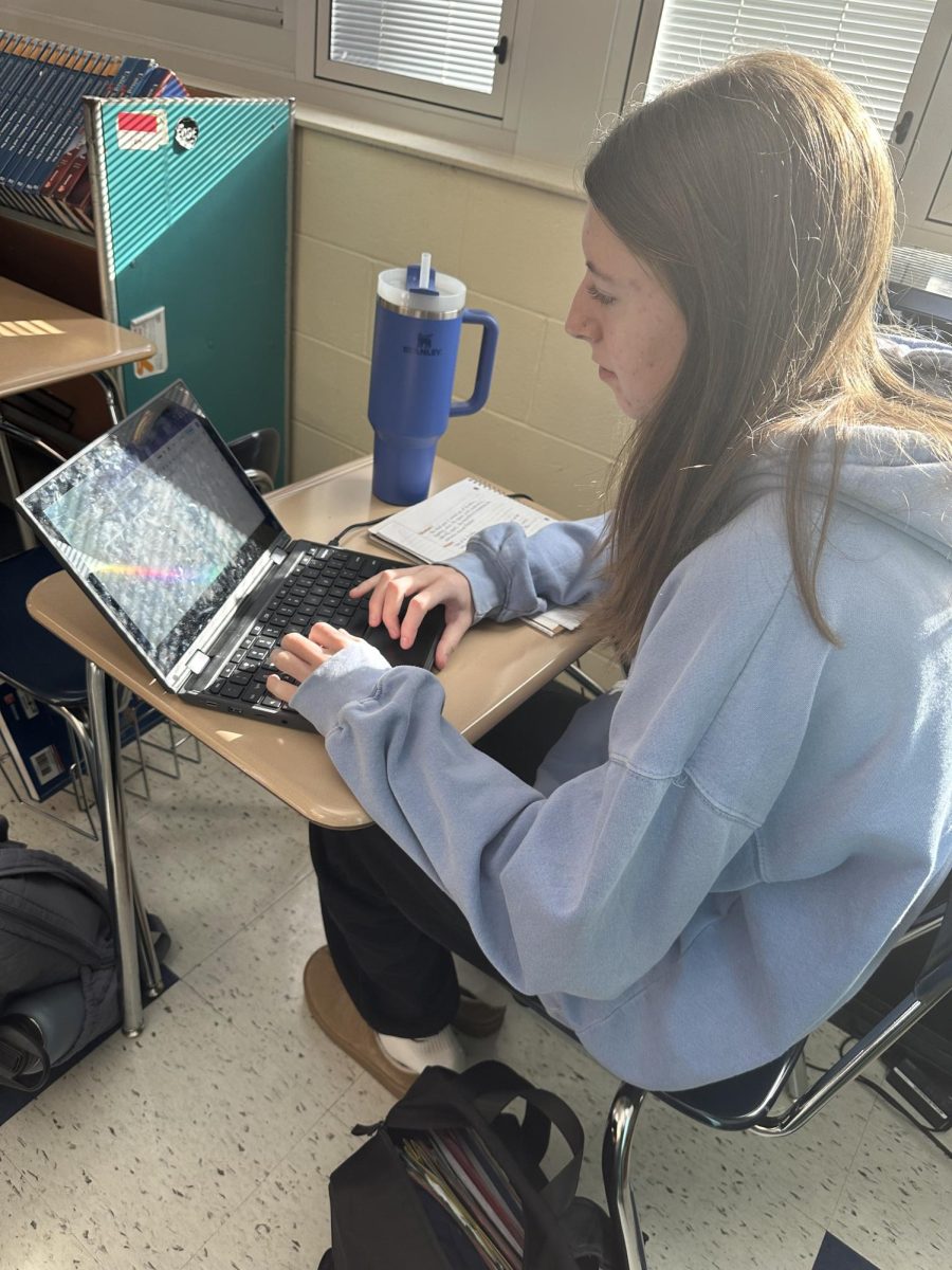 Junior Leah Sparks works on the AP Psychology study guide as she prepares for exams. She is very stressed as some information learned over the first trimester is omitted. 

