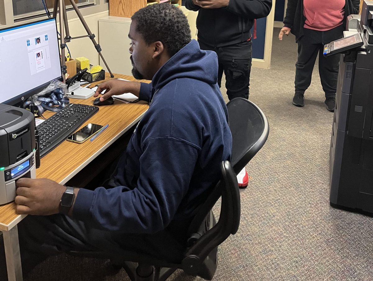 Behavioral secretary Kyle Robertson prints new student I.D.s in the Guidance Office every morning. Students must state their 6-digit I.D. number and pay the five dollar fine prior to graduation.