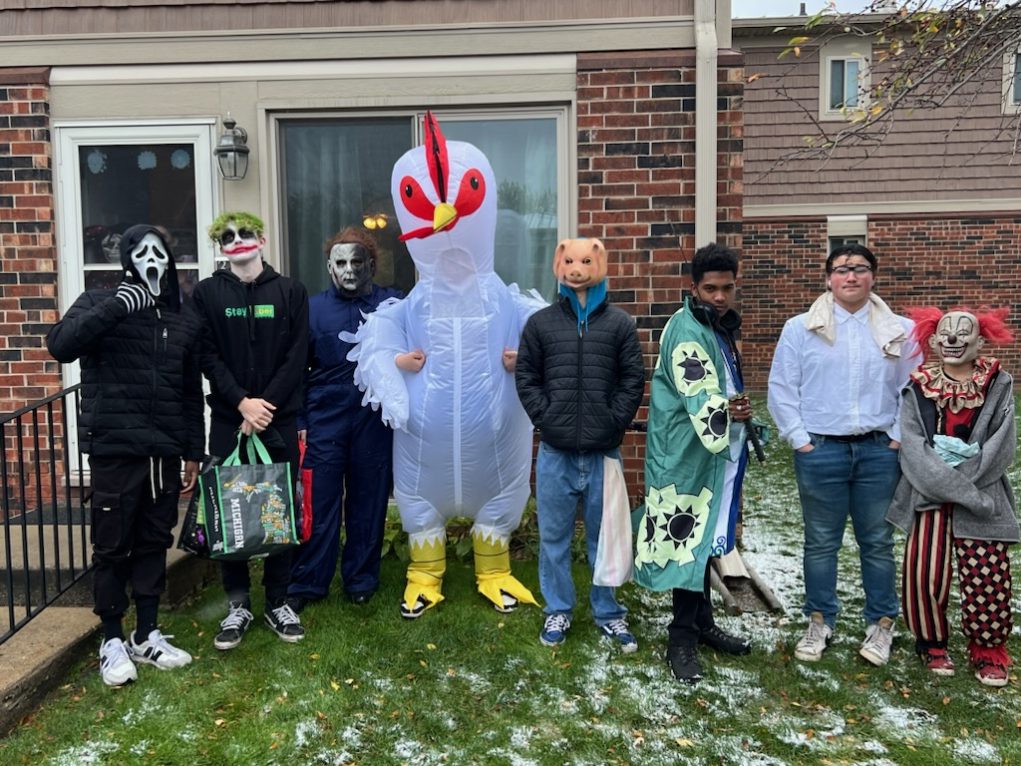 Loy Norrix Students (Left to right) Isaiah Gonzalez, Aiden Verbrigghe, August Johnson, Ryan Kelly, and Kristian Padula stand together to take a Halloween photo. The group got a total of 75 pounds of candy in four hours. 
