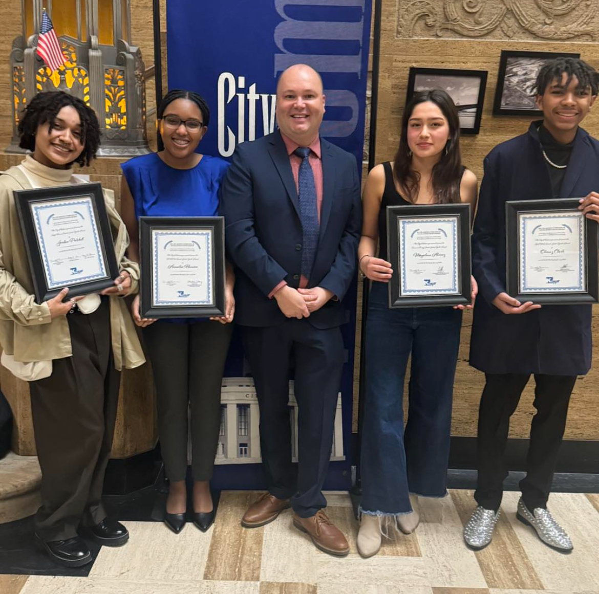 Social Justice Youth Award winners pose with Principal Christopher Aguinaga. The awards ceremony took place at the City Commision meeting. 
