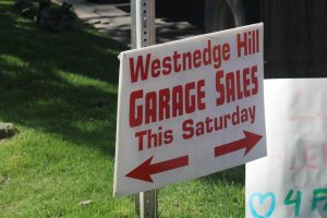 A sign promotes a garage sale in the Westnedge Hill neighborhood. On Saturday, there were many signs around town promoting the sale.