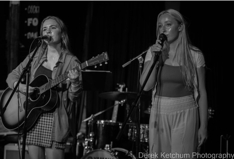 Annabelle Fuerst (left) and Payton Carter (right) performing at Old Dog Tavern while opening for the Corn Fed Girls.
