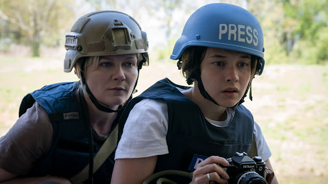 Kirsten Dunst (left) and Cailee Spaeny (right) are pictured during an intense scene in “Civil War”. Spaeny’s character, Jessie, is introduced to the front lines of the war for the first time and must overcome her fear to document the violence. 
Photo courtesy of Murray Close in Civil War. 