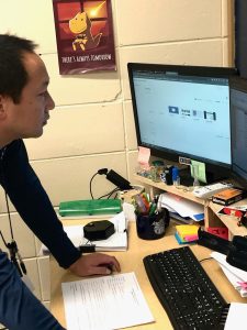 Math teacher Corey O’Bryan prepares classwork on his computer. As well as  teaching geometry, O’Bryan also coaches Archery club and Sword and Board.
