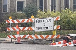 On the intersection of South Westnedge and Vine Street, a construction sign spells “Road Closed To Thru Traffic.” These signs are a common sight around downtown Kalamazoo recently.