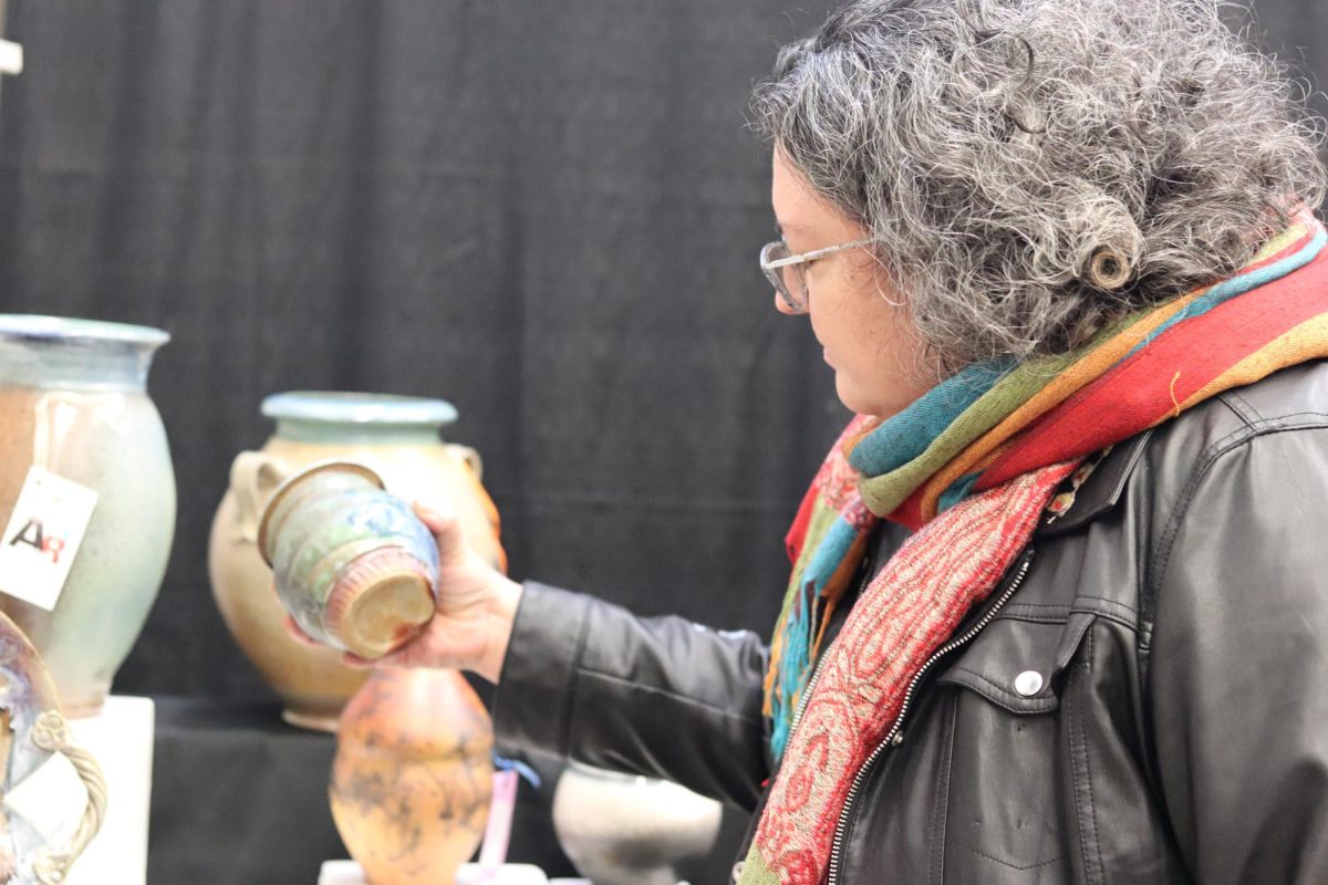 Ceramicist Sarah Schmidt-Lee browses the pottery rooms, admiring the hand-built pieces of her peers. Schmidt-Lee has been taking ceramic classes at the KIA for over a year. 